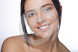 Close up portrait of beautiful young happy smiling woman, isolated over white background