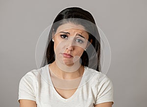 Human expressions, emotions. Young attractive woman with a sad face, looking depressed and unhappy photo