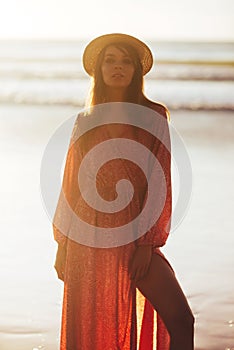 Close up portrait of beautiful young woman on the beach.