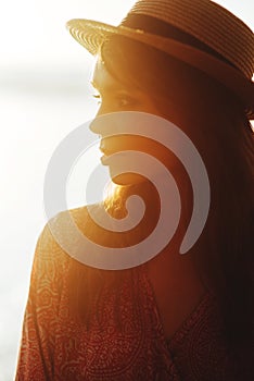 Close up portrait of beautiful young woman on the beach.