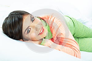 Close up portrait of beautiful young woman in bed. Smiling dre