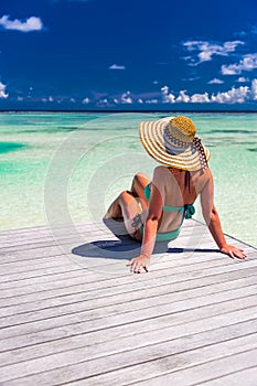Close up portrait of beautiful young woman enjoying the sun at beach. Summer travel concept design. Summer beach vacation holiday