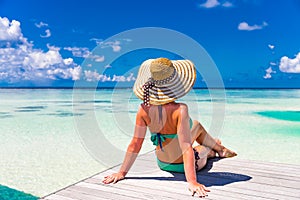 Close up portrait of beautiful young woman enjoying the sun at beach. Summer travel concept design. Summer beach vacation holiday