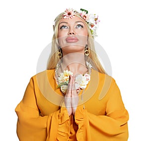 Close up portrait of beautiful young woman praying on white background