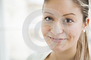 Close-up portrait of beautiful young woman smiling