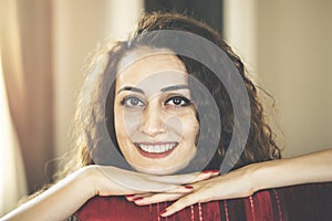 Close up portrait of a beautiful young woman smiling