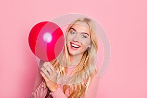 Close up portrait of beauty, cute girl with red air balloons laughing over pink background, beautiful Happy Young woman on birthda