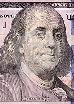 Close-up portrait of Benjamin Franklin. One hundred US dollars