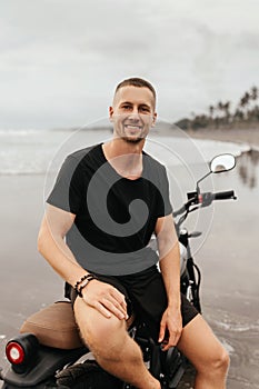 Close up portrait of biker at beach of Bali Indonesia.