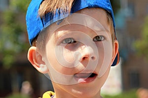 Close up portrait of a boy with serious face expression