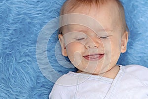 Close-up portrait of a breast newborn baby boy