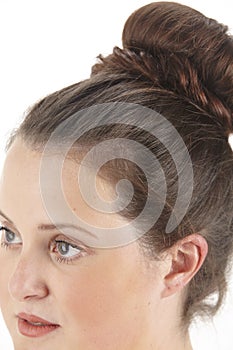 Close up portrait of a brunette woman with chignon