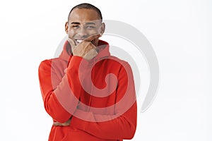 Close-up portrait of carefree, happy african-american man, laughing and smiling, having conversation with friend