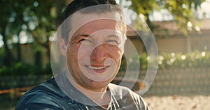 Close-up portrait caucasian man male happy face. European senior business man smiling adult pensive guy stands on street