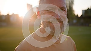 Close up portrait Caucasian old gray-haired man looking at camera happy pensioner smiling toothy dental smile fun enjoy