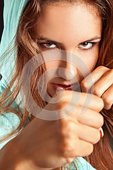 Close up portrait of caucasian woman in boxing stance