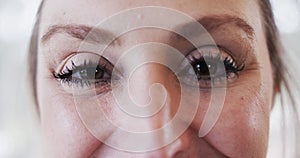 Close up portrait of caucasian young woman with beautiful eyes in yoga studio