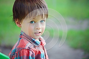 Close-up portrait of cheerful little boy