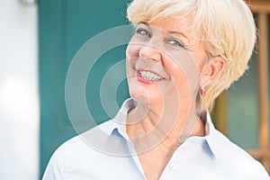 Close-up portrait of a cheerful senior woman with good health an