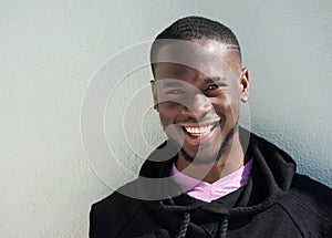 Close up portrait of a cheerful young black man smiling