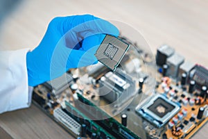 Close up portrait of computer engineer`s hand is holding CPU`s c