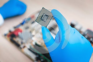 Close up portrait of computer engineer`s hand is holding CPU`s c
