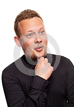 Close up portrait of a confident, blond, handsome young man wearing black shirt, isolated on white background