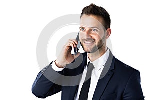 Close-up portrait of confident businessman using phone while standing at isolated white background