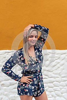 Close up portrait of a confident young woman smiling outdoors