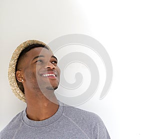 Close up portrait of a cool guy laughing with hat