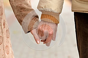 Close up portrait of a couple holding hands together