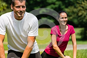 Close up portrait of couple stretching outdoors