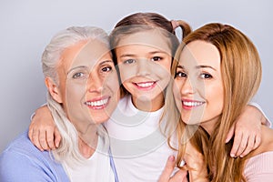 Close up portrait of cute nice friendly lovely adorable beautiful with toothy beaming smile embracing family isolated on gray