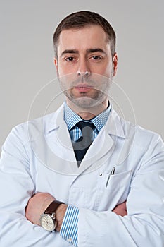 Close-up portrait of doctor with crossed arms