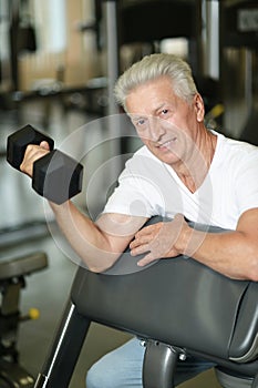 Close up portrait of elderly man in gym