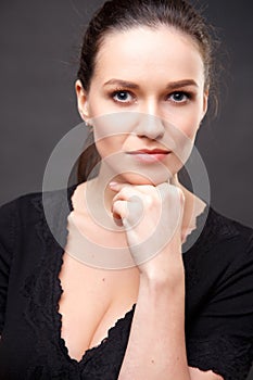 Close up portrait of elegant brunette woman with nude make up