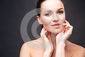 Close up portrait of elegant brunette woman with nude make up