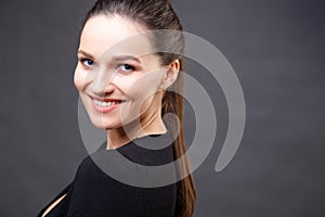 Close up portrait of elegant brunette woman with nude make up