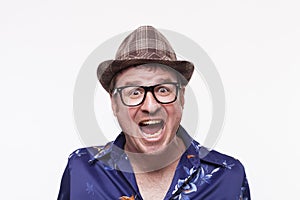 Close-up portrait of a excited mid adult man with mouth open