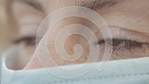 Close-up Portrait Eyes Woman Wearing Protective Medical Face Mask and Looking 4k