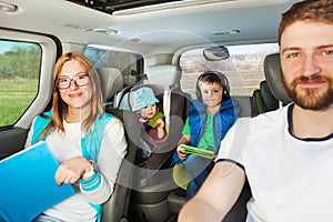 Close-up portrait of family travelling by car