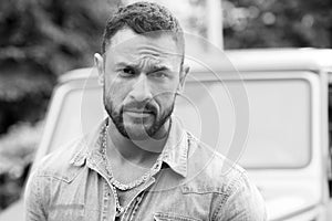 Close up portrait of fashionable latin man outside. Handsome man looking at camera. Portrait of self confident man.