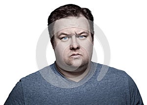 Close up portrait of fat man in studio sceptical. Isolated on white background.
