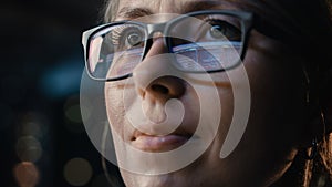 Close-up Portrait of Female Software Engineer Working on Computer, Programming Reflecting in Glasses