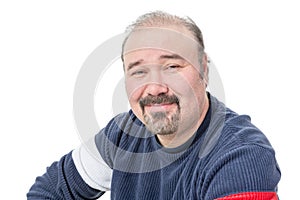 Close-up portrait of a friendly balding mature man