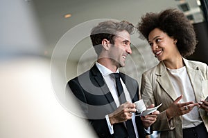 Close up portrait of friends enjoying the break from meeting while drinking coffee