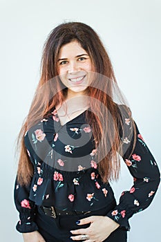 Close up portrait of funny attractive pretty girl with long ginger fair hair standing on white background.