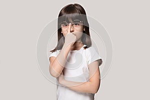 Close up portrait with funny little brown-haired girl with eyewear.