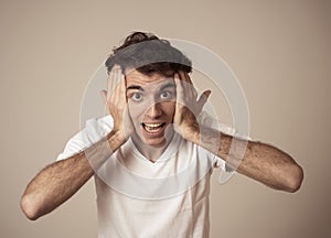 Close up portrait of funny man surprised and happy celebrating victory and wining team or lottery