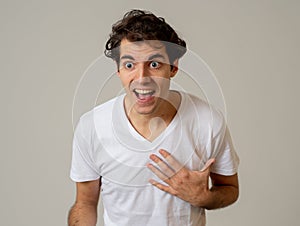 Close up portrait of funny man surprised and happy celebrating victory and wining team or lottery photo